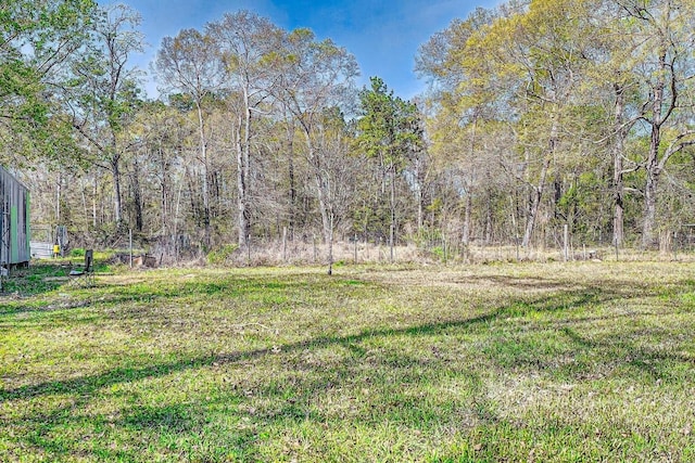 170 Trails End Dr, Cleveland, TX 77328 - view of yard featuring a wooded view