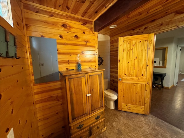 164 Pine Hollow Cv, Brookeland, TX 75931 - bathroom featuring electric panel, toilet, wooden walls, and wood ceiling