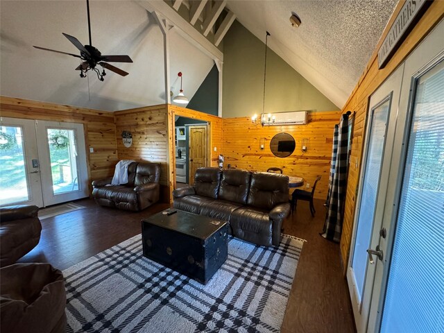 164 Pine Hollow Cv, Brookeland, TX 75931 - living area with french doors, wood walls, vaulted ceiling, ceiling fan, and wood finished floors