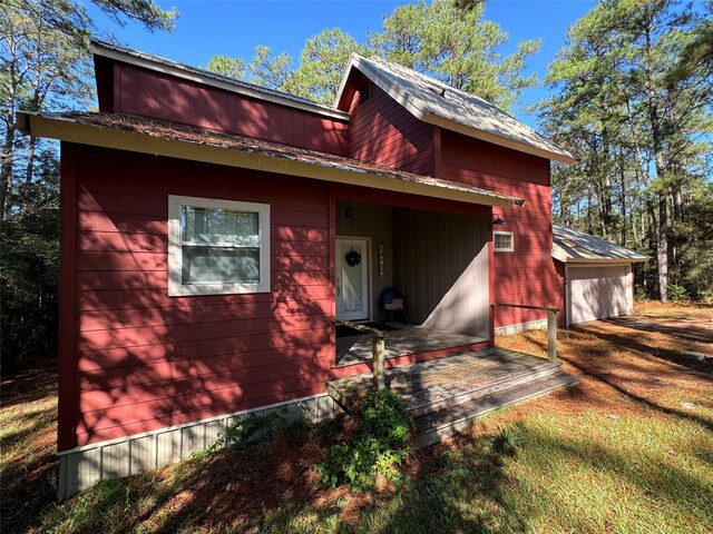 164 Pine Hollow Cv, Brookeland, TX 75931 - view of front of property with a garage