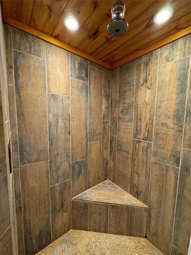 164 Pine Hollow Cv, Brookeland, TX 75931 - detailed view of tiled shower, wood ceiling, and recessed lighting