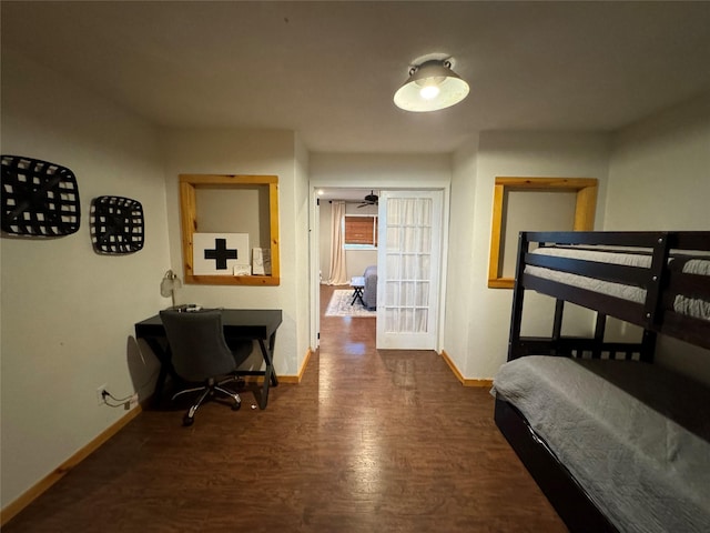 164 Pine Hollow Cv, Brookeland, TX 75931 - bedroom with baseboards, wood finished floors, and a desk