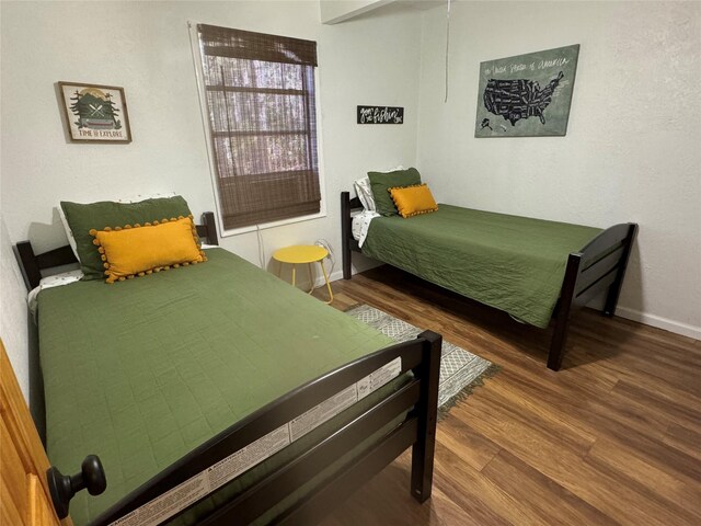 164 Pine Hollow Cv, Brookeland, TX 75931 - bedroom featuring wood finished floors and baseboards