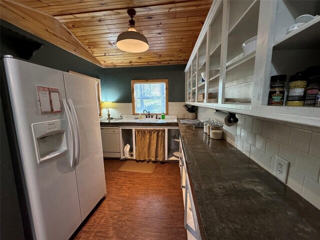 164 Pine Hollow Cv, Brookeland, TX 75931 - kitchen with white appliances, wooden ceiling, a sink, decorative backsplash, and dark wood finished floors