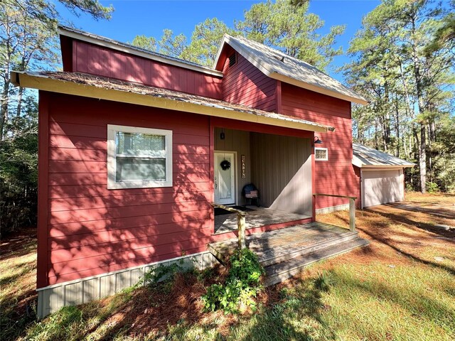 164 Pine Hollow Cv, Brookeland, TX 75931 - view of front of home featuring a garage
