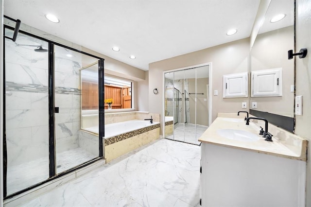 21102 Marcin Dr, Spring, TX 77388 - bathroom featuring marble tiled flooring, a bath, a marble finish shower, double vanity, and recessed lighting