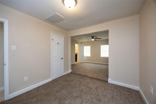 6319 Winfield Rd, Houston, TX 77050 - carpeted empty room featuring ceiling fan and baseboards
