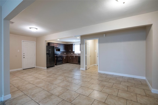 6319 Winfield Rd, Houston, TX 77050 - kitchen with black appliances, dark brown cabinetry, light tile patterned flooring, baseboards, and recessed lighting