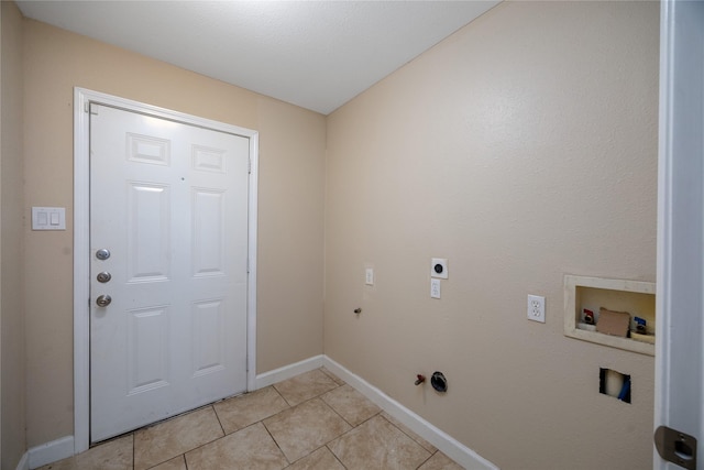 6319 Winfield Rd, Houston, TX 77050 - laundry area with hookup for a gas dryer, hookup for a washing machine, light tile patterned floors, hookup for an electric dryer, and baseboards
