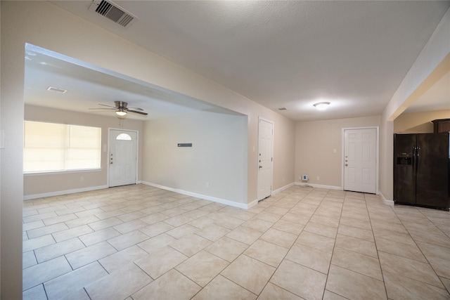 6319 Winfield Rd, Houston, TX 77050 - spare room featuring a ceiling fan, light tile patterned flooring, and baseboards