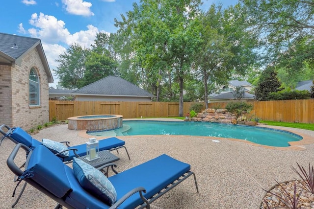 126 S Bluff Creek Cir, The Woodlands, TX 77382 - view of swimming pool with a fenced backyard, a patio, and a pool with connected hot tub