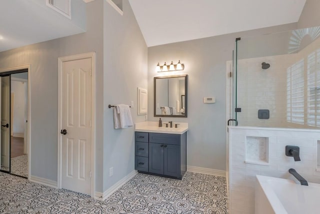 126 S Bluff Creek Cir, The Woodlands, TX 77382 - full bath featuring a tub to relax in, vanity, tiled shower, vaulted ceiling, and tile patterned flooring