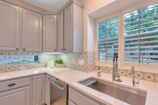 126 S Bluff Creek Cir, The Woodlands, TX 77382 - kitchen with dishwasher, light countertops, and decorative backsplash