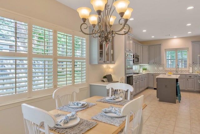 126 S Bluff Creek Cir, The Woodlands, TX 77382 - dining space featuring a chandelier, recessed lighting, and light tile patterned floors