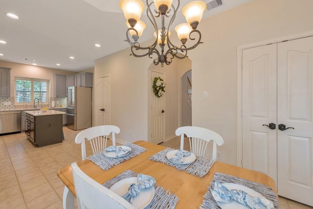 126 S Bluff Creek Cir, The Woodlands, TX 77382 - dining room with arched walkways, a chandelier, and recessed lighting