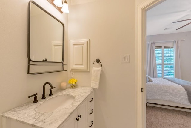 126 S Bluff Creek Cir, The Woodlands, TX 77382 - ensuite bathroom featuring vanity and ceiling fan