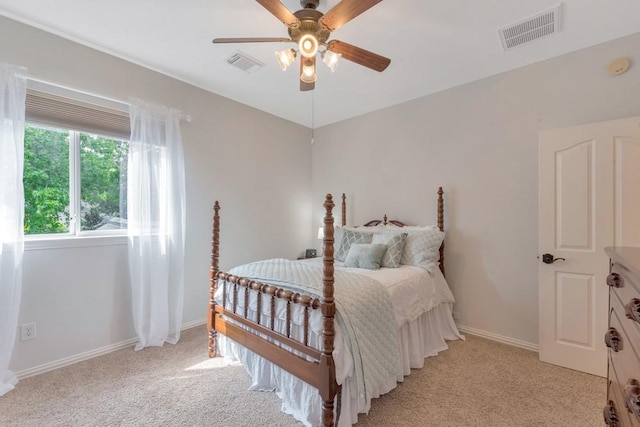 126 S Bluff Creek Cir, The Woodlands, TX 77382 - bedroom with light carpet and a ceiling fan