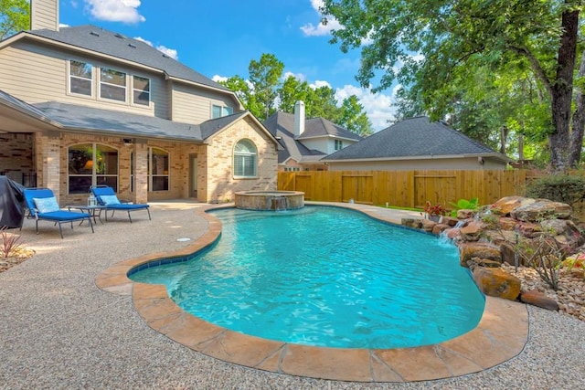 126 S Bluff Creek Cir, The Woodlands, TX 77382 - view of swimming pool with a patio, a fenced backyard, and a pool with connected hot tub