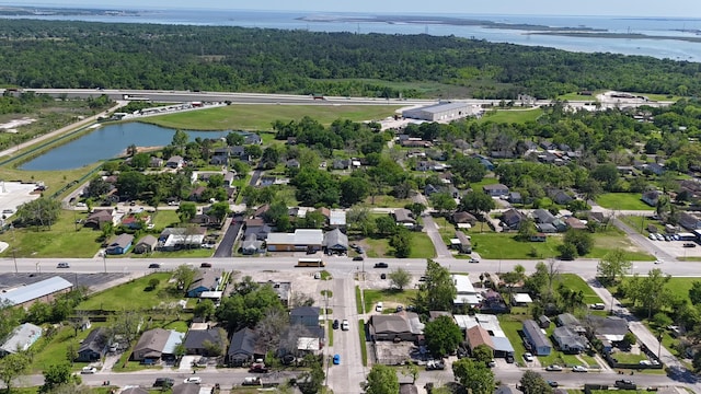 322 W Nazro St, Baytown, TX 77520 - aerial view of property and surrounding area featuring a large body of water, a heavily wooded area, and nearby suburban area