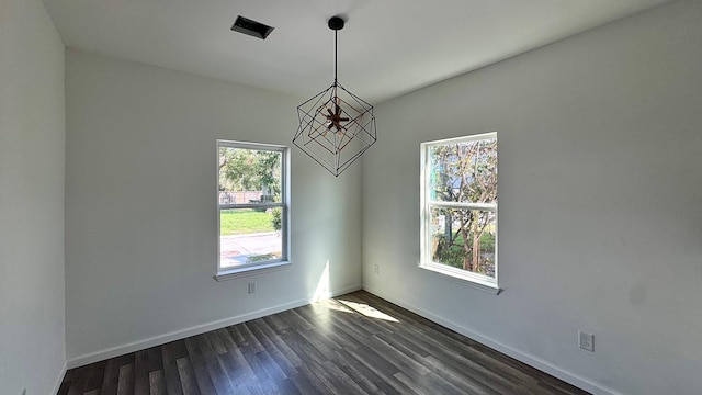 322 W Nazro St, Baytown, TX 77520 - spare room with dark wood-type flooring, a chandelier, and baseboards