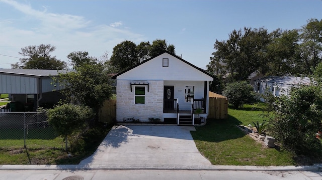 322 W Nazro St, Baytown, TX 77520 - bungalow featuring covered porch and stone siding
