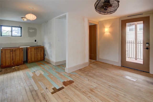 239 Westheimer Rd, Houston, TX 77006 - unfurnished dining area featuring light wood-style floors and baseboards