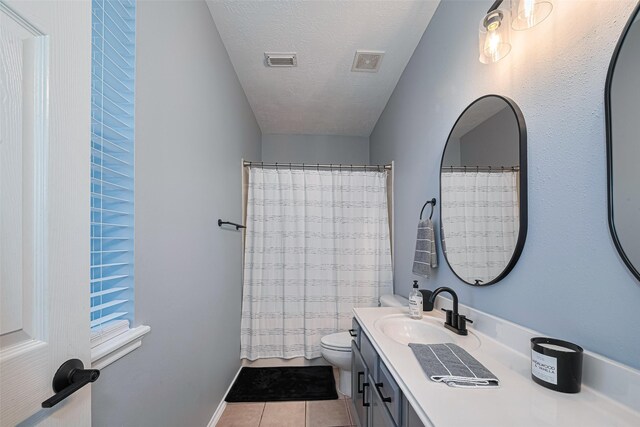 17810 Laurelton Dr, Humble, TX 77396 - bathroom with a textured ceiling, vanity, tile patterned flooring, and a shower with curtain