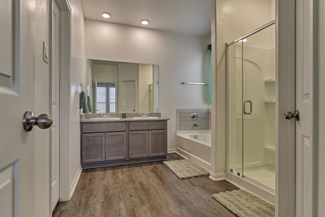 14208 Sedona Ridge Dr, Conroe, TX 77303 - full bathroom featuring a shower stall, wood finished floors, a bath, and double vanity