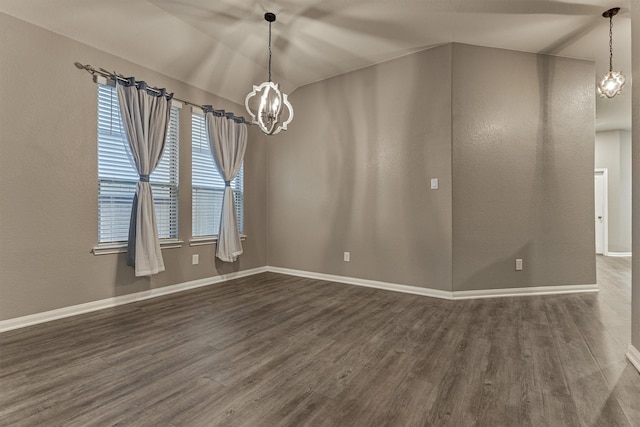 14208 Sedona Ridge Dr, Conroe, TX 77303 - empty room featuring a chandelier, dark wood finished floors, and vaulted ceiling