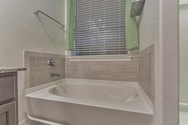 14208 Sedona Ridge Dr, Conroe, TX 77303 - bathroom with a textured wall and a garden tub