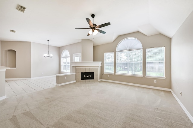 11510 Amber Canyon Dr, Houston, TX 77095 - unfurnished living room featuring light colored carpet, a ceiling fan, a chandelier, a tile fireplace, and vaulted ceiling