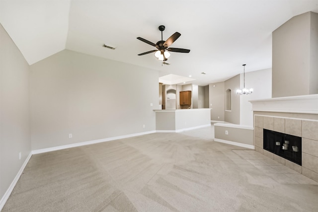 11510 Amber Canyon Dr, Houston, TX 77095 - unfurnished living room with ceiling fan, light colored carpet, a tiled fireplace, a chandelier, and lofted ceiling