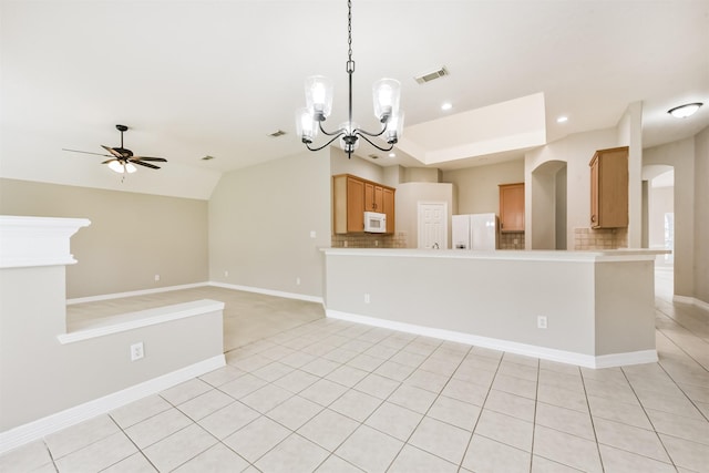 11510 Amber Canyon Dr, Houston, TX 77095 - kitchen featuring white appliances, arched walkways, backsplash, ceiling fan, and a chandelier