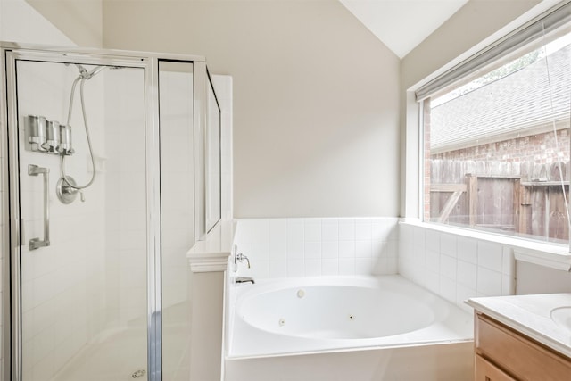 11510 Amber Canyon Dr, Houston, TX 77095 - full bath with a shower stall, a tub with jets, vanity, and lofted ceiling
