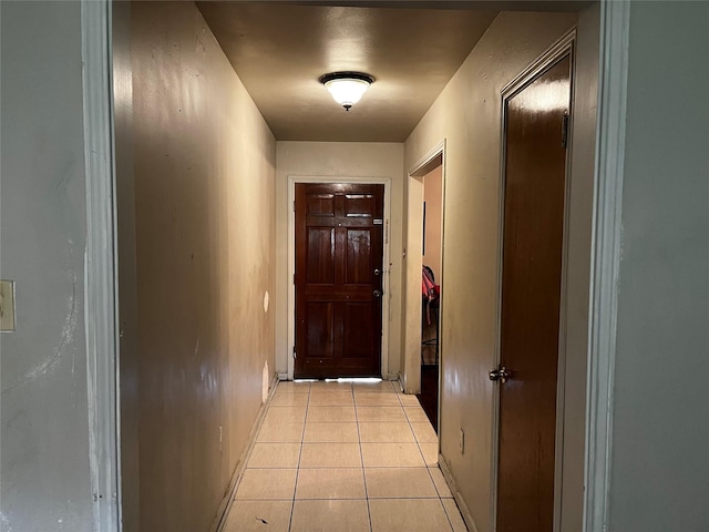 7727 Log Hollow Dr, Houston, TX 77040 - corridor featuring light tile patterned flooring and baseboards