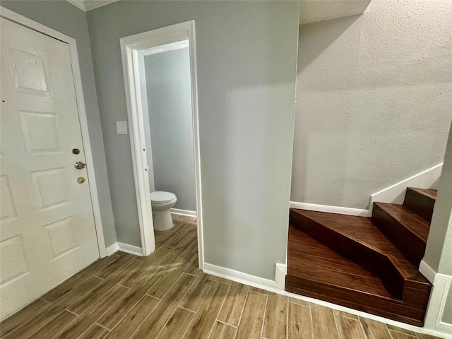 11000 Kinghurst Dr Unit 189, Houston, TX 77099 - bathroom featuring wood finished floors, baseboards, and toilet