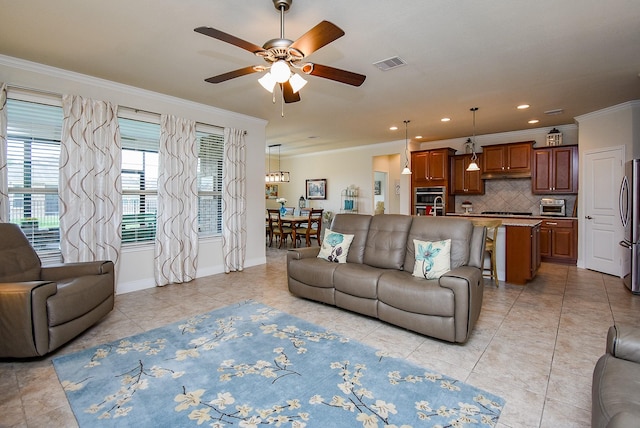 235 Ranch House Ln, Richmond, TX 77469 - living area with ornamental molding, ceiling fan, light tile patterned floors, baseboards, and recessed lighting