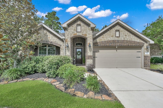 138 Verismo Ct, Montgomery, TX 77316 - french country home with stone siding, driveway, a garage, brick siding, and a front yard