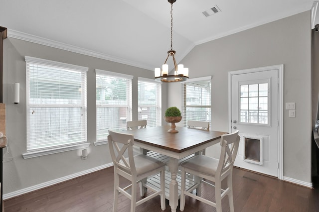 138 Verismo Ct, Montgomery, TX 77316 - dining space featuring a chandelier, ornamental molding, lofted ceiling, and dark wood-type flooring