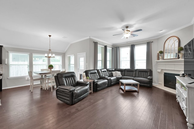138 Verismo Ct, Montgomery, TX 77316 - living room featuring crown molding, ceiling fan, plenty of natural light, a chandelier, and dark wood finished floors