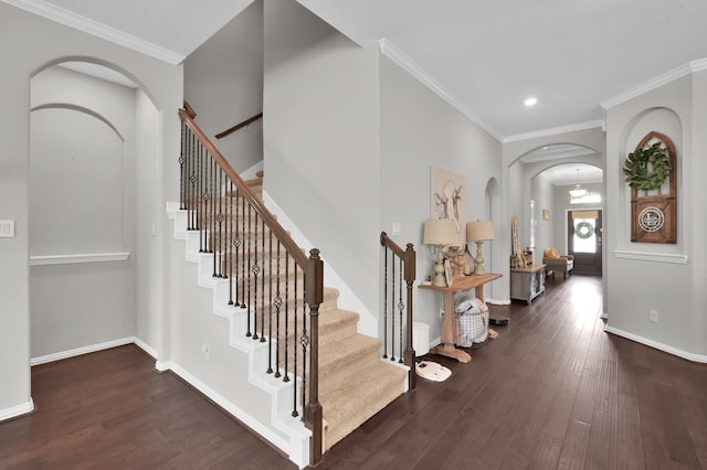 138 Verismo Ct, Montgomery, TX 77316 - entryway featuring arched walkways, wood finished floors, recessed lighting, stairway, and crown molding