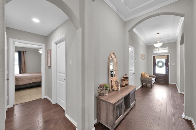138 Verismo Ct, Montgomery, TX 77316 - entrance foyer featuring arched walkways, dark wood finished floors, and crown molding