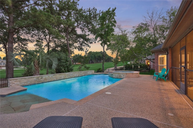 16 Waterberry Way, Montgomery, TX 77356 - pool at dusk featuring a patio area and a pool with connected hot tub
