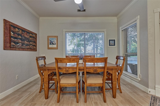 16 Waterberry Way, Montgomery, TX 77356 - dining room featuring light wood-type flooring, plenty of natural light, ornamental molding, and a ceiling fan