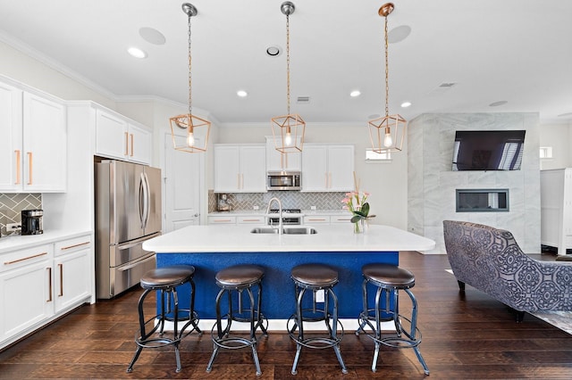 10812 Kyler Oaks Pl, Houston, TX 77043 - kitchen with stainless steel appliances, ornamental molding, a kitchen breakfast bar, backsplash, and open floor plan