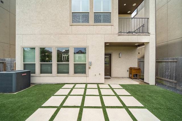 10812 Kyler Oaks Pl, Houston, TX 77043 - view of patio featuring central AC and a balcony