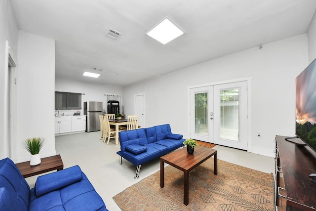 4409 Brady St, Houston, TX 77011 - living room featuring french doors and light flooring