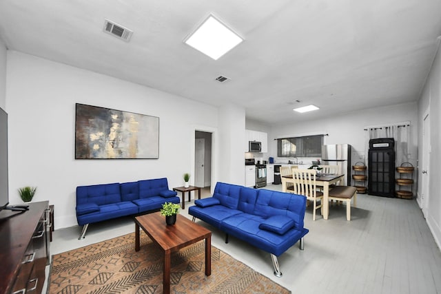 4409 Brady St, Houston, TX 77011 - living room featuring baseboards