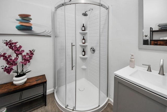 4409 Brady St, Houston, TX 77011 - bathroom with vanity, a shower stall, and wood finished floors