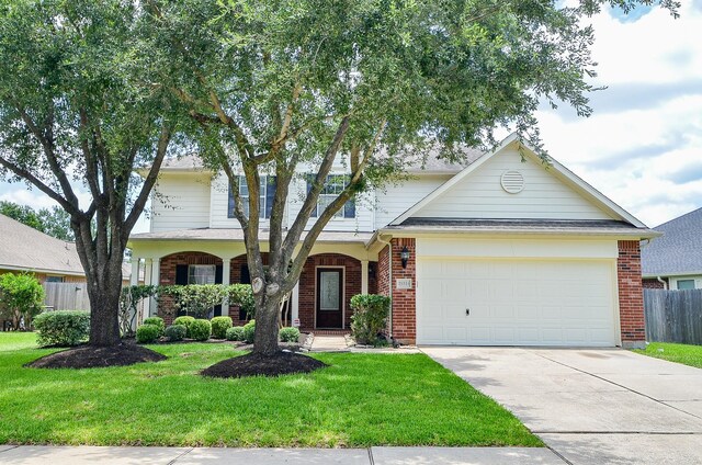 25314 Sandy Trace Ln, Katy, TX 77494 - view of front of home featuring brick siding, driveway, and a garage